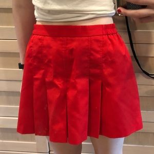 red pleated skort